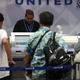At United, that human touch begins at the counter and doesn't end until you're forcibly removed from your seat. (Photo: Justin Sullivan/Getty)